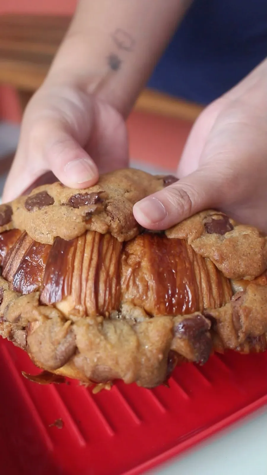 Chocolate-chip cookie dough baked over a glossy sourdough croissant