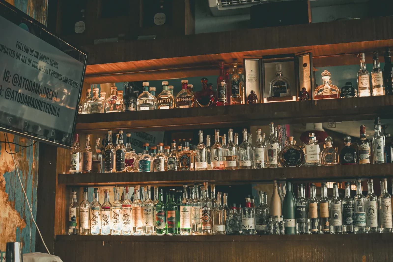 Back bar lined with bottles of tequila and mezcal