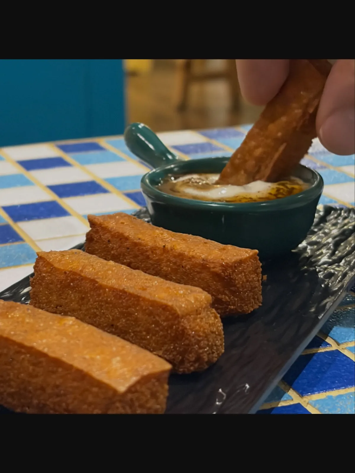 Crisp fried hummus sticks served with a creamy dip