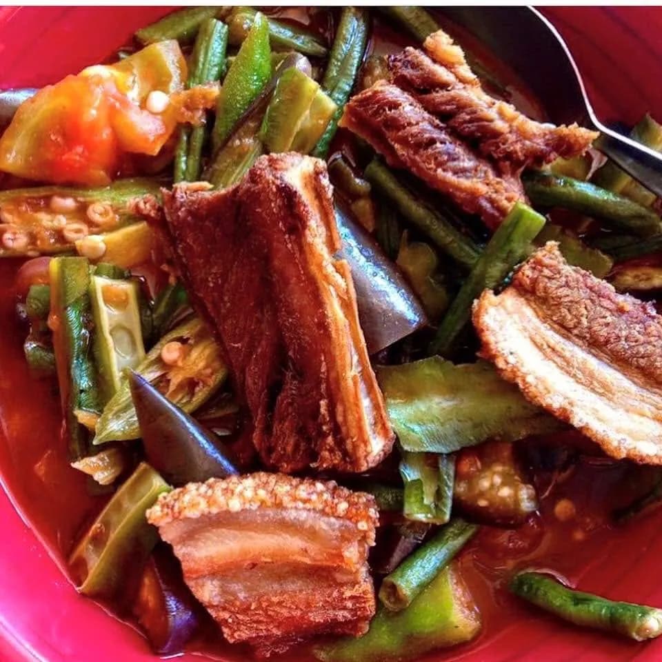 Pinakbet vegetables topped with thick pieces of crisp bagnet